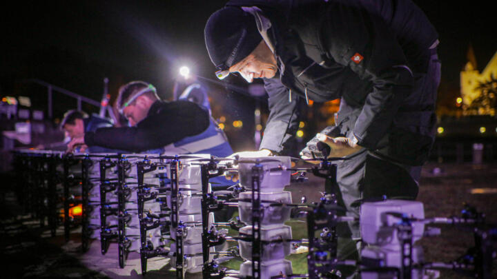 Technicians from DroneDreams in Germany prepare the LED drones for a show